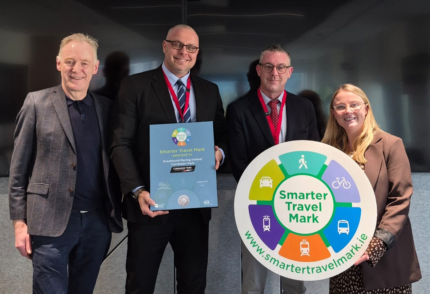 Greyhound Racing Ireland Receives Smarter Travel Mark at Curraheen Park TFI staff pictured with Adam Smietanski, Hospitality & Facilities Manager, and Thomas Ryan, Events & Sponsorships Manager, following the presentation of the Smarter Travel Mark to Greyhound Racing Ireland at Curraheen Park.