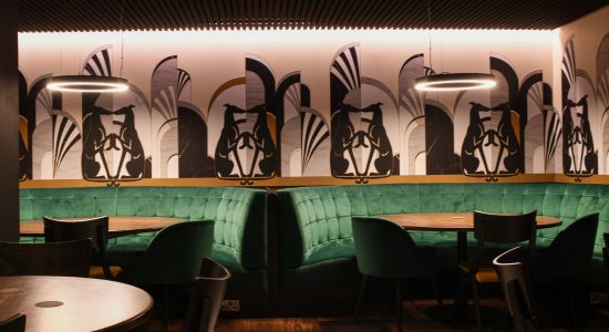 Image shows the modern design  aesthetic, with a nod to Art Deco, in the new 1927 Lounge in Shelbourne Park with velvet booths, lighting creating the perfect mood and eye-catching wallpaper to create a unique and inviting look in the space. 