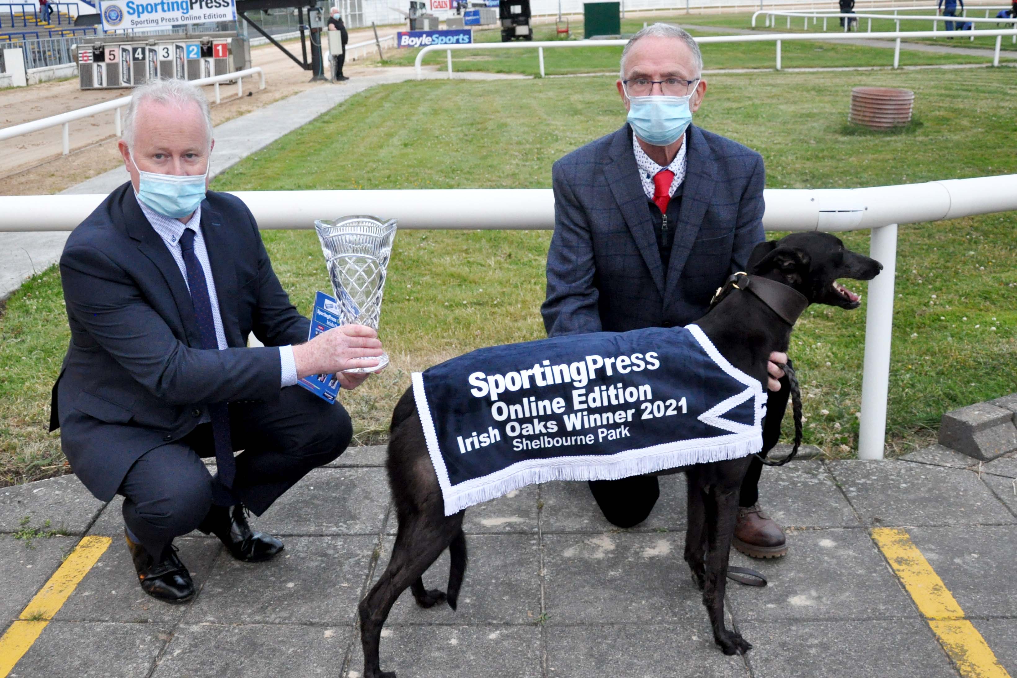 DJ Histon CEO ICC presents the trophy to Peter Comerford after Susie Sapphire won the 2021 Sporting Press Online  Edition Irish Oaks Final at Shelbourne Park